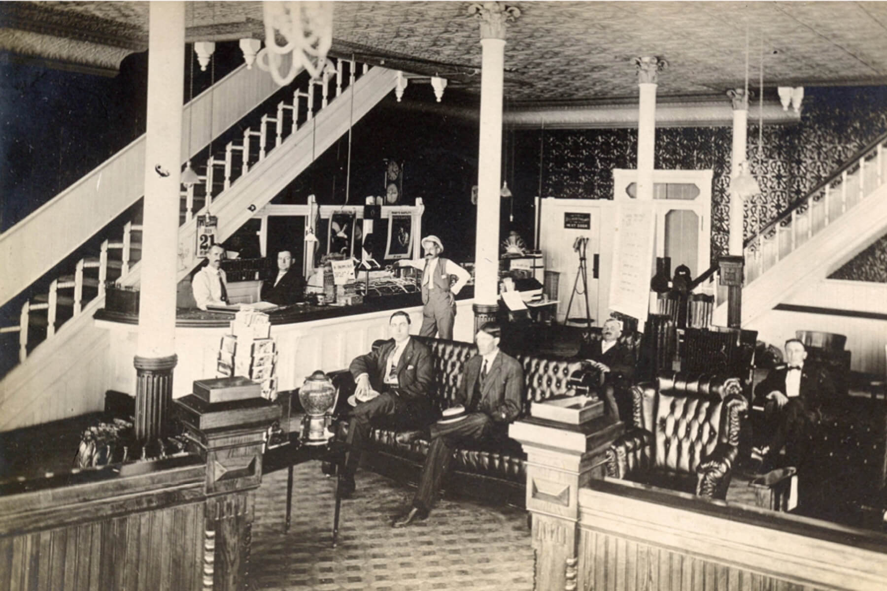 old photograph of men sitting in the lobby of the keefer house hotel