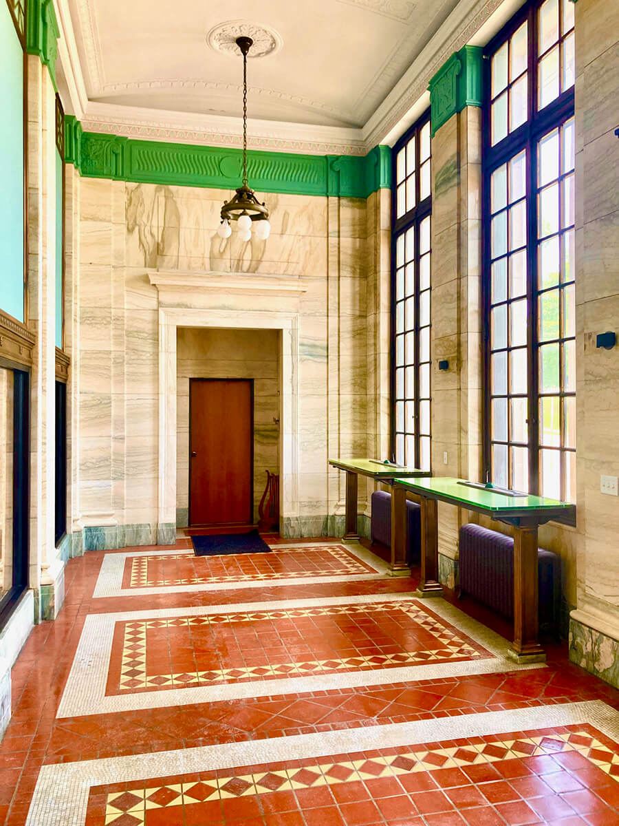 Post office lobby showing large floor to ceiling windows